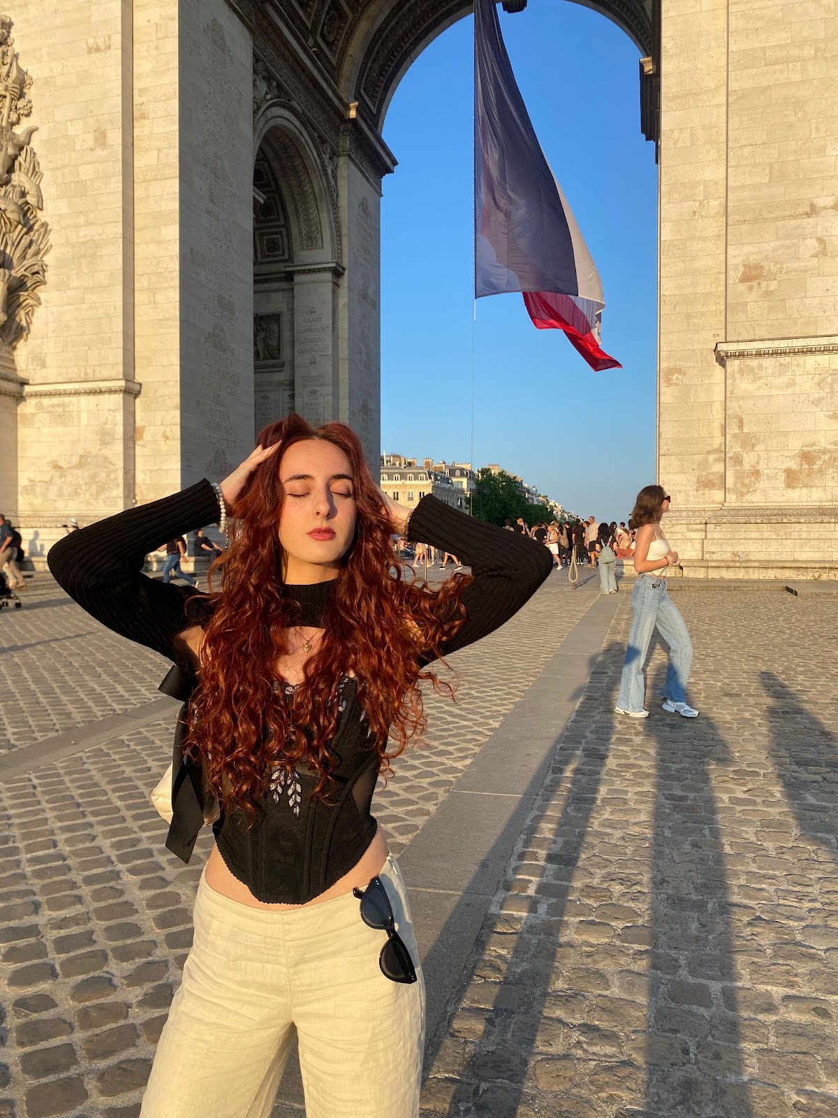 Posing by the Arc de Triomphe